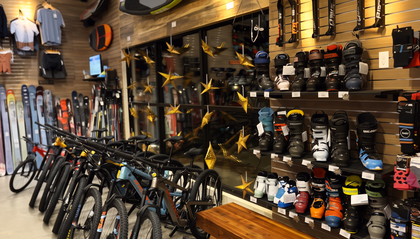Inside the Gravity Coalition store: a wall of skis, bikes on the floor, ski boots and apparel